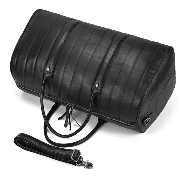 Regal Black Leather Duffel Bag laid down on side with shoulder strap detached